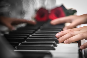 Obraz premium Talented woman playing piano, close up