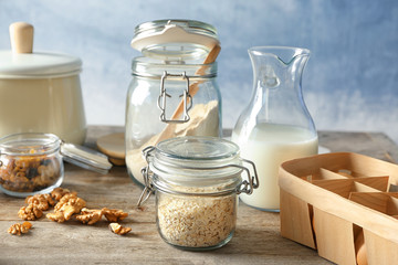 Composition with cooking utensils and ingredients on wooden table