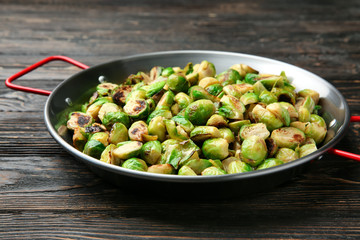 Frying pan with roasted brussel sprouts on table