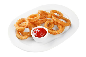 Plate with fried breaded onion rings and ketchup on white background