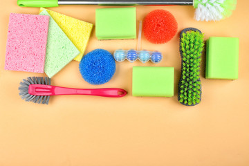 Cleaning supplies on color background