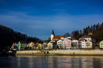 Fototapeta na wymiar View of Passau with Danube river, embankment and cathedral, Bavaria, Germany