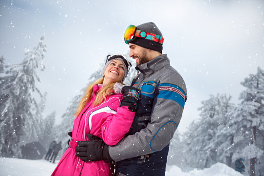 Couple in love on snowy nature together