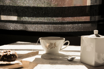 Porcelain tea cup, at breakfast time on the table