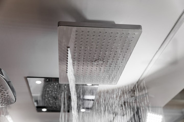 Modern shower with water drops in bath interior
