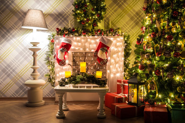 New year green tree decorated with presents and flashing garland, classic white christmas interior background.