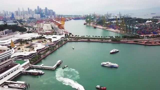 Singapore. November 21, 2017: Aerial shot of VivoCity shopping mall and Singapore container port. Shot in 4k resolution