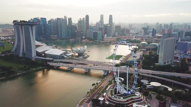 Singapore. November 21, 2017: Aerial view footage of Singapore Flyer with the city skyline, Marina Bay Sands Hotel, skyscrapers. Shot in 4k resolution