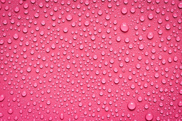 Water Drops On Red Background.