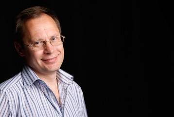 Fototapeta premium White Man in glasses posing in studio