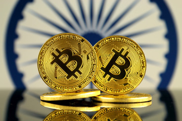 Physical version of Bitcoin and India Flag. Close up.