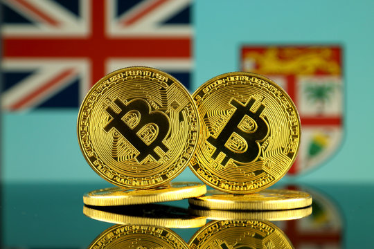 Physical version of Bitcoin and Fiji Flag. Close up. - Powered by Adobe