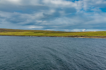 lands between sky and ocean panorama of Scotland in England in summer