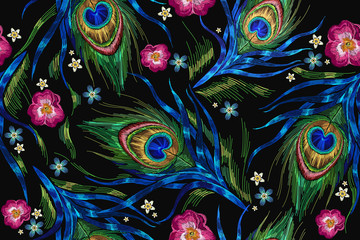 Embroidery peacock feathers and roses flowers seamless pattern. Classical fashionable embroidery beautiful peacocks feathers. Fashionable template for design of clothes. Tails of peacocks vector