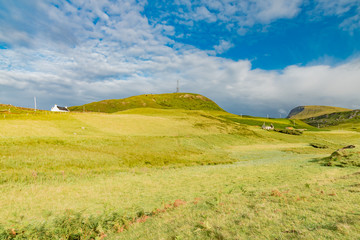 lands between sky and ocean panorama of Scotland in England in summer