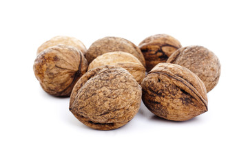 Walnuts on isolated white studio photo. Walnut with shell.