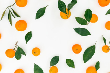 Frame made of fresh citrus and leaves on white background. Flat lay. Top view