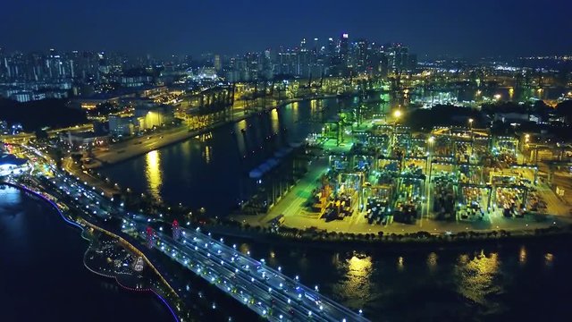Singapore. November 21, 2017: Beautiful aerial shot of Singapore container port at night. Shot in 4k resolution