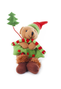 Christmas bear decoration. Cute plush toy decor for christmas. Mini Teddy bear wearing christmas costume. Winter holiday isolated white photo. Christmas concept.