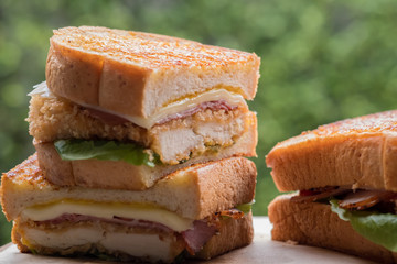 Close up chicken cordon bleu sandwich. (selective focus)
