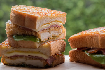 Close up chicken cordon bleu sandwich. (selective focus)