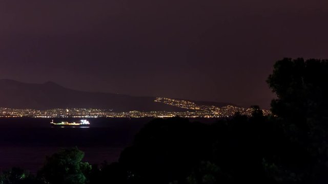 4K Timelapse at Salamina Island by night with boats