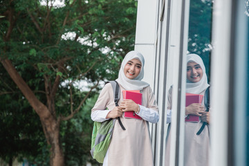 muslim asian student with head scarf