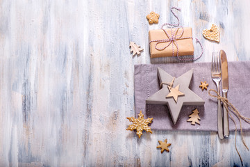Christmas table setting with christmas star decoration and gingerbread cookie copy space, festive dinner