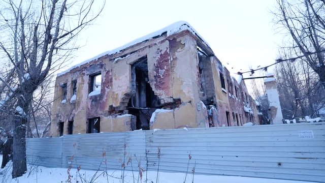 Interior of ruined, abandoned administrative, residential building after fire. Ruin The ruins of an abandoned ruined house. As depressive background for thrash design