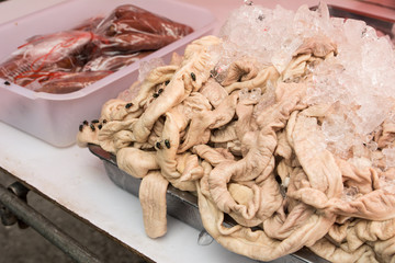 Gut of pork in the tray at market