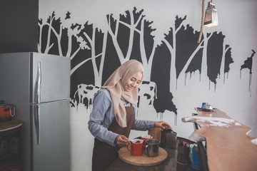 Fototapeta na wymiar muslim asian worker preparing the menu