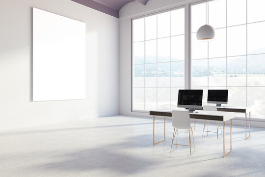 White office with blank screen computers