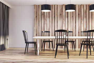 White and wooden dining room, black chairs