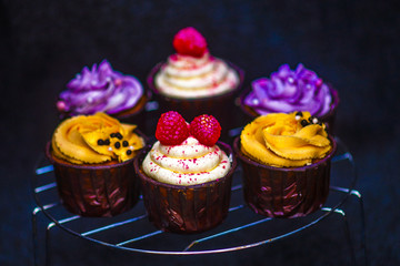 yellow, raspberry and purple homemade cupcakes