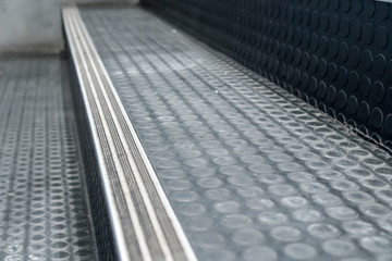 Non-slip stairs with dot pattern close up for background.