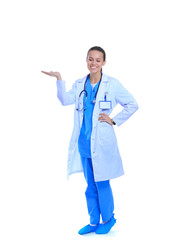 Beautiful young woman in white coat posing with hand in pocket. Woman doctor