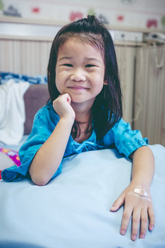 Illness Asian Child Admitted In Hospital With Band-aid On Hand.