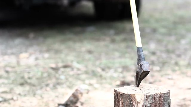 One single Ax Swing for Chopping and Splitting Fire Wood