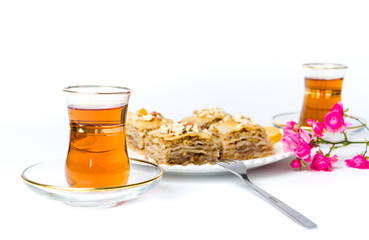 Baklava and turkish tea on white background