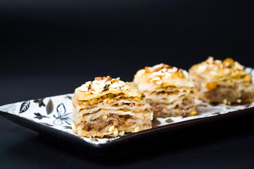 Baklava dessert slices on dark background