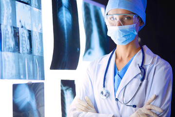 Image of attractive woman doctor looking at x-ray results