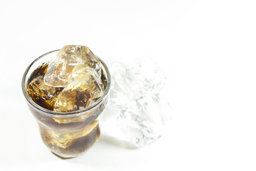 glasses of ice cold cola soda pop with ice on isolated white