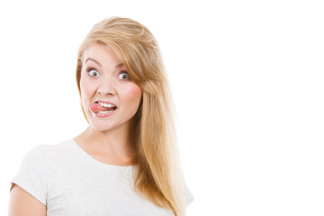 Naklejka premium Funny blonde woman sitcking tongue out