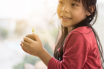 Asian girl prepares seeds to grow.