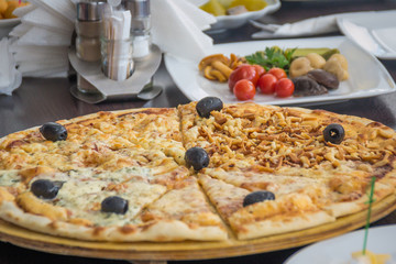 Big pizza with olives.