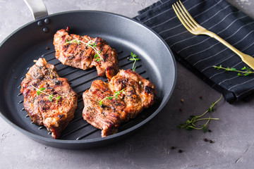 Grilled steak with thyme and pepper.