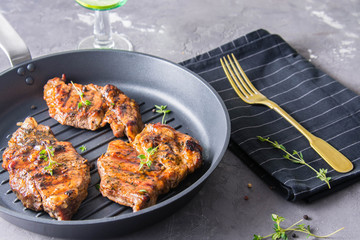 Grilled steak with thyme and pepper.