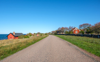 Traditional red cottage during autumn on Swedish Baltic sea island Oland. Oland is a popular tourist destination in Sweden during summertime.