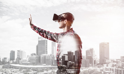 Guy wearing checked shirt and virtual mask stretching hand to to