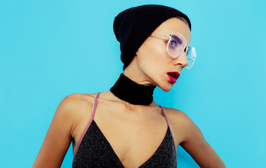 Tomboy model  in fashion glasses and fashion accessory season Beanie Cap and choker. Be in Trend
